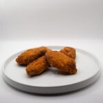 Alette di pollo (1 ° falange) precotte e panate